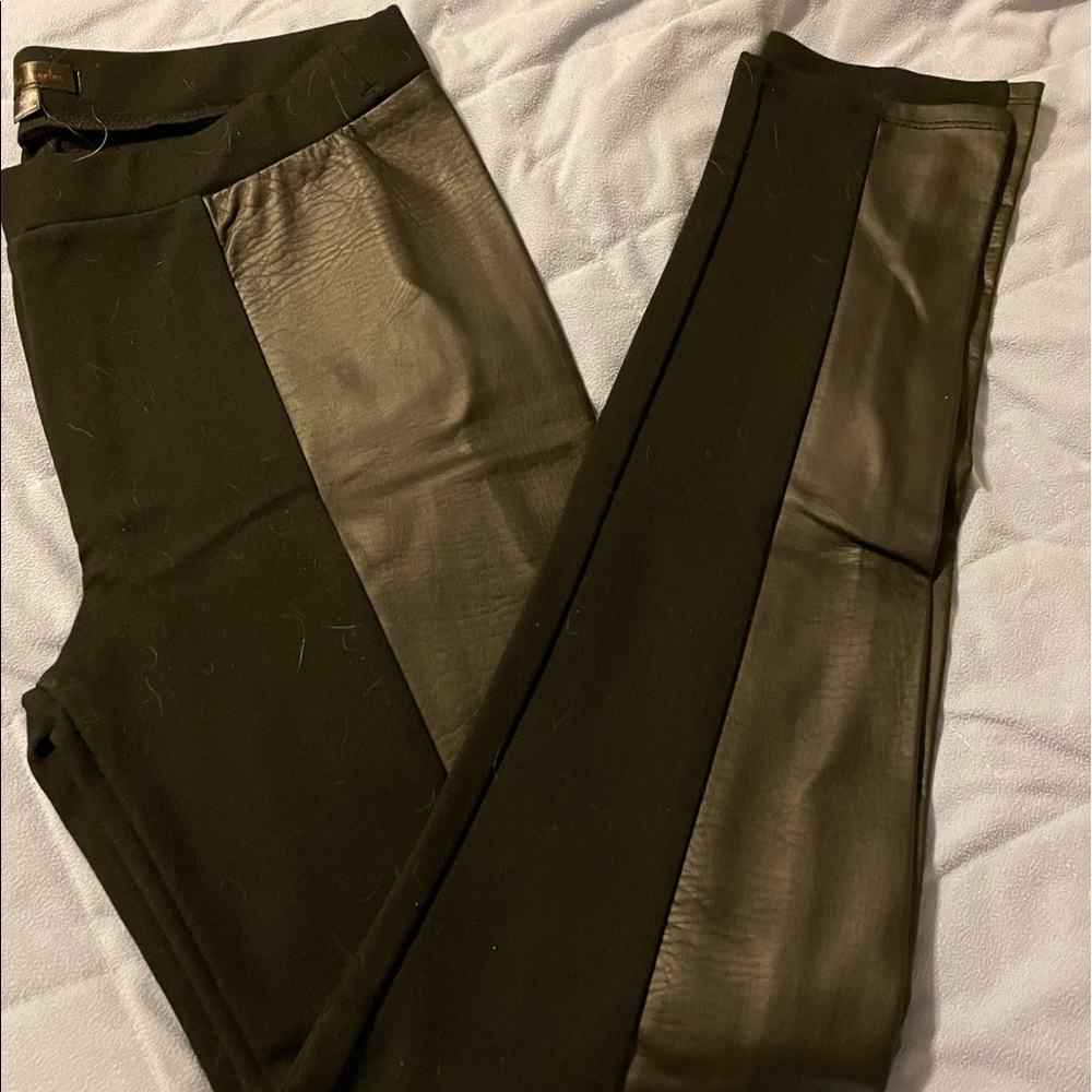 Black leggings with leather down both sides. New Condition.